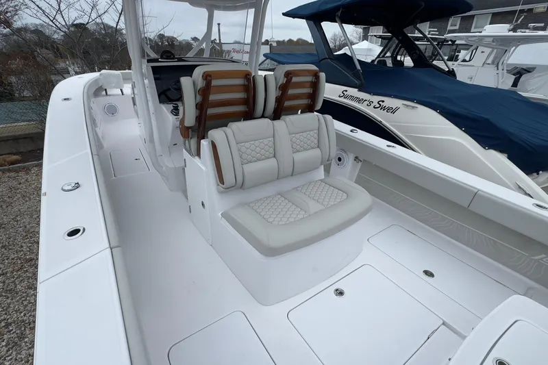  Yacht Photos Pics 2024 Jupiter 32 FS boat interior with cushioned seating and sleek design.