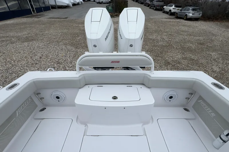  Yacht Photos Pics 2024 Jupiter 32 FS boat with dual Mercury engines, parked on gravel.