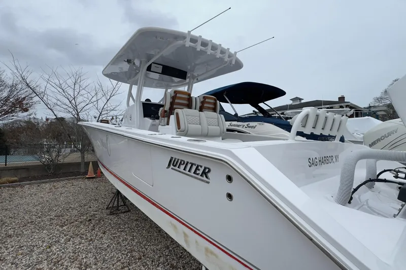  Yacht Photos Pics 2024 Jupiter 32 FS boat in Sag Harbor, NY, on gravel lot.