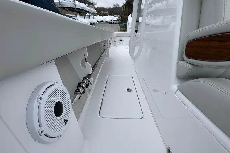  Yacht Photos Pics 2024 Jupiter 32 FS boat interior with speaker and storage compartment.