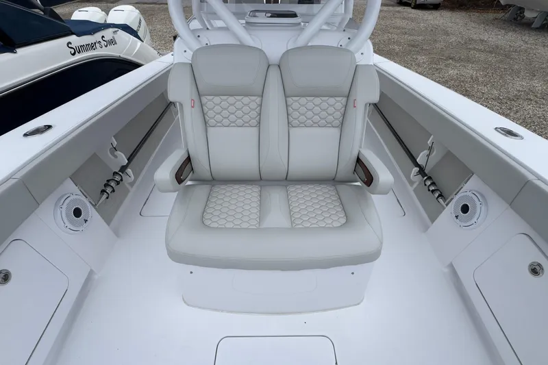  Yacht Photos Pics 2024 Jupiter 32 FS boat interior with cushioned seating and modern design.