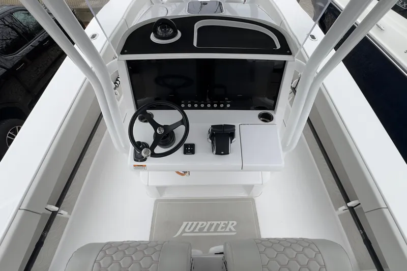  Yacht Photos Pics 2024 Jupiter 32 FS boat helm with steering wheel and control panel.