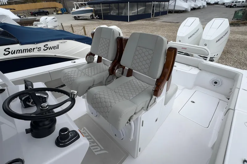  Yacht Photos Pics 2024 Jupiter 32 FS boat interior with dual seats and steering wheel.