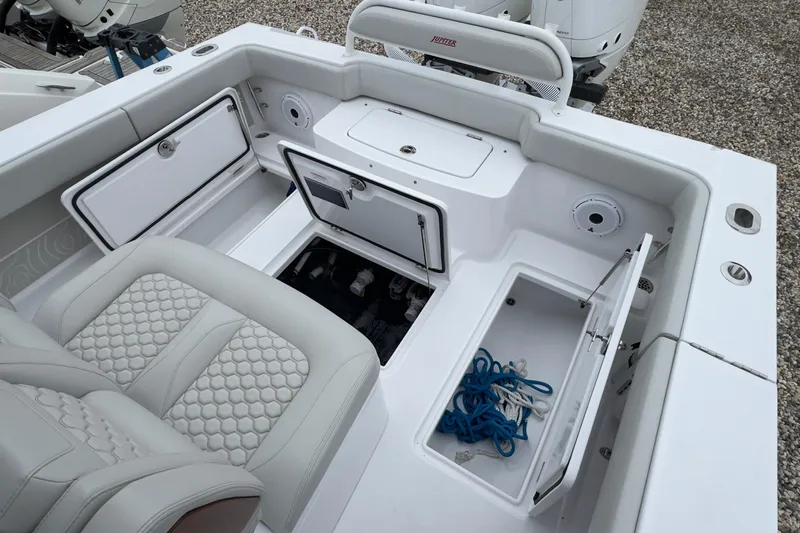 Yacht Photos Pics 2024 Jupiter 32 FS boat interior with storage compartments and seating.