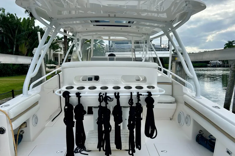  Yacht Photos Pics 2012 Intrepid 400 Cuddy boat interior with fishing rod holders and ropes.