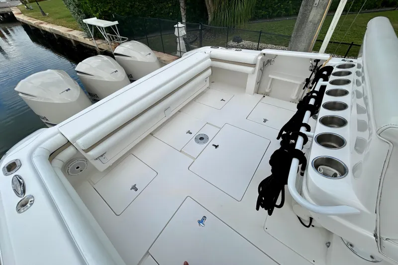  Yacht Photos Pics 2012 Intrepid 400 Cuddy boat deck with seating, rod holders, and Yamaha engines.