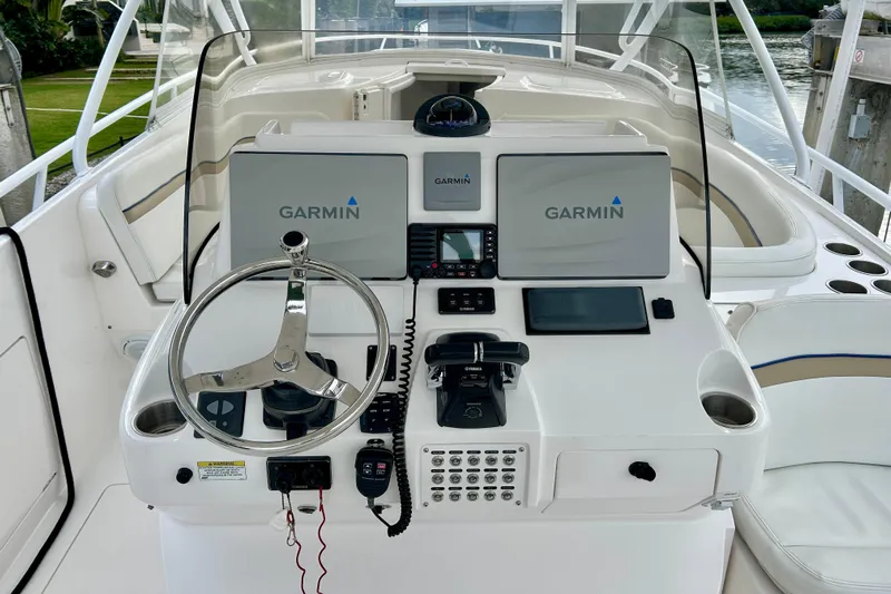  Yacht Photos Pics 2012 Intrepid 400 Cuddy helm with Garmin navigation displays and steering wheel.