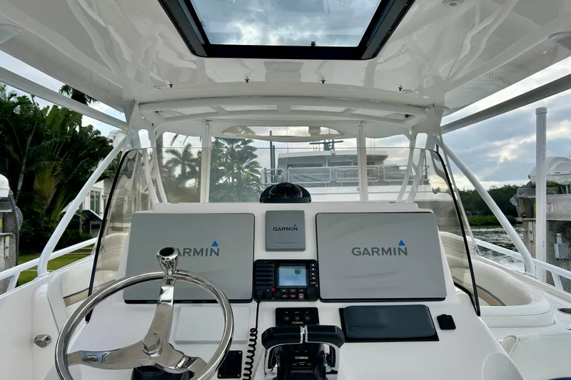  Yacht Photos Pics Cockpit of 2012 Intrepid 400 Cuddy with Garmin navigation system and sleek steering wheel.