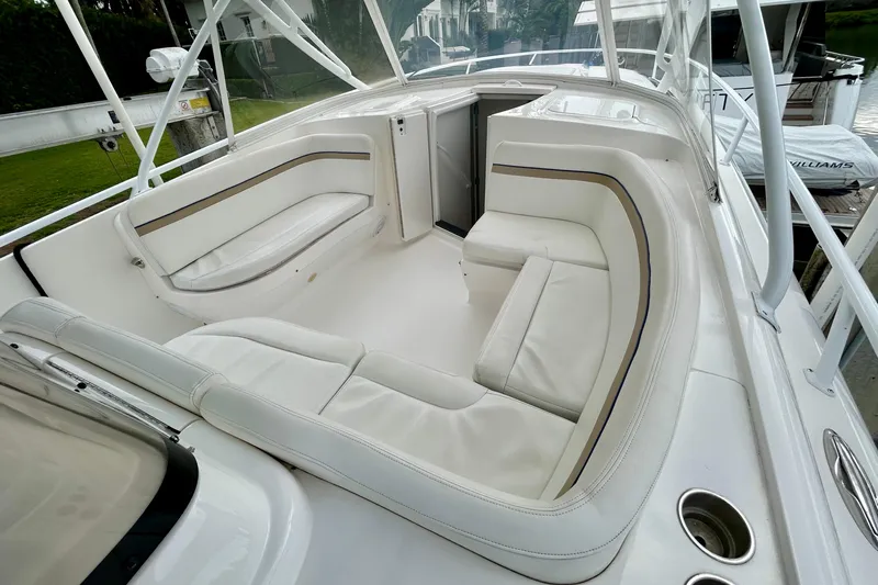  Yacht Photos Pics Luxurious seating area on a 2012 Intrepid 400 Cuddy boat, featuring white upholstery.