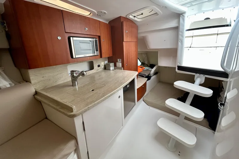  Yacht Photos Pics Luxurious 2012 Intrepid 400 Cuddy interior with modern kitchen and cozy seating area.
