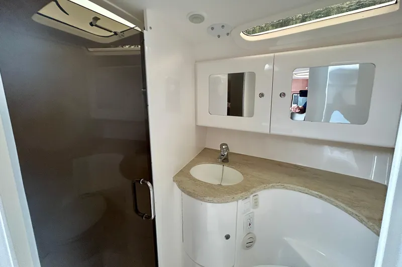  Yacht Photos Pics Luxurious bathroom interior of 2012 Intrepid 400 Cuddy boat with modern fixtures.