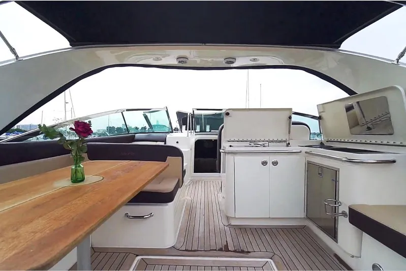 Money Making Mitch Yacht Photos Pics 2015 Sea Ray 370 Venture yacht interior with dining area and kitchenette.