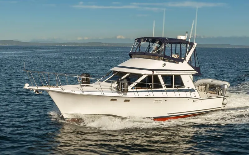 La Paz Yacht Photos Pics 1993 Tollycraft 40 Sport Sedan cruising on open water under clear skies.