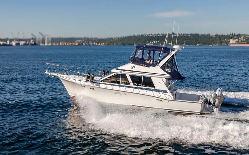 La Paz Yacht Photos Pics 1993 Tollycraft 40 Sport Sedan cruising on open water under clear skies.