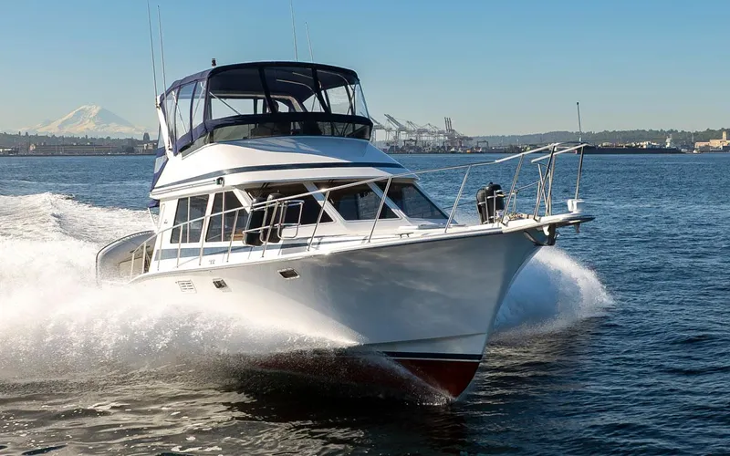 La Paz Yacht Photos Pics 1993 Tollycraft 40 Sport Sedan cruising on open water, showcasing sleek design and performance.