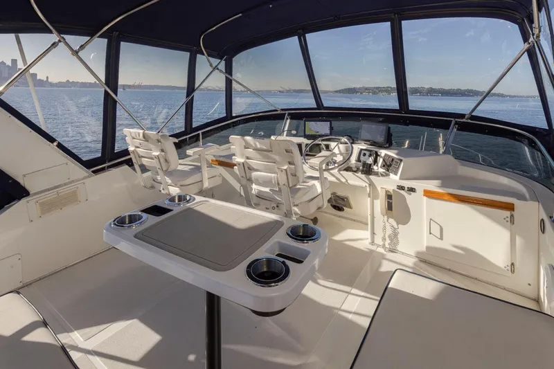 La Paz Yacht Photos Pics 1993 Tollycraft 40 Sport Sedan yacht interior with helm, seating, and ocean view.