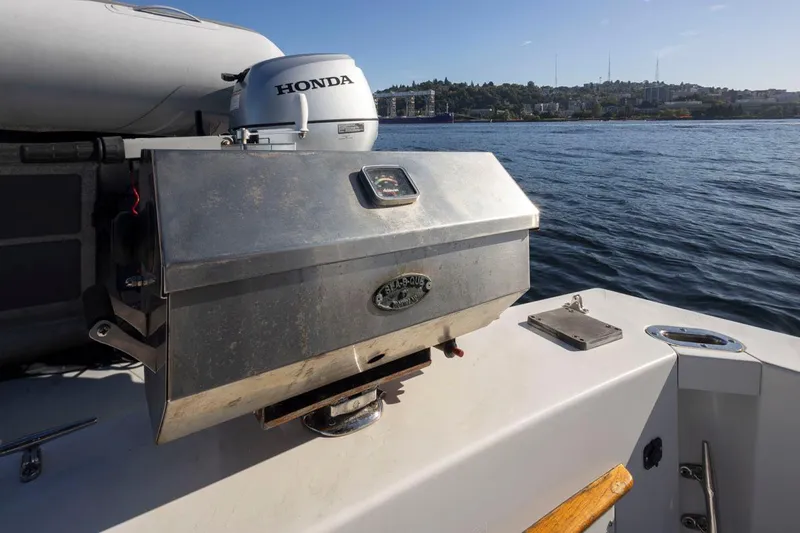 La Paz Yacht Photos Pics 1993 Tollycraft 40 Sport Sedan with a stainless steel grill on deck, near water.