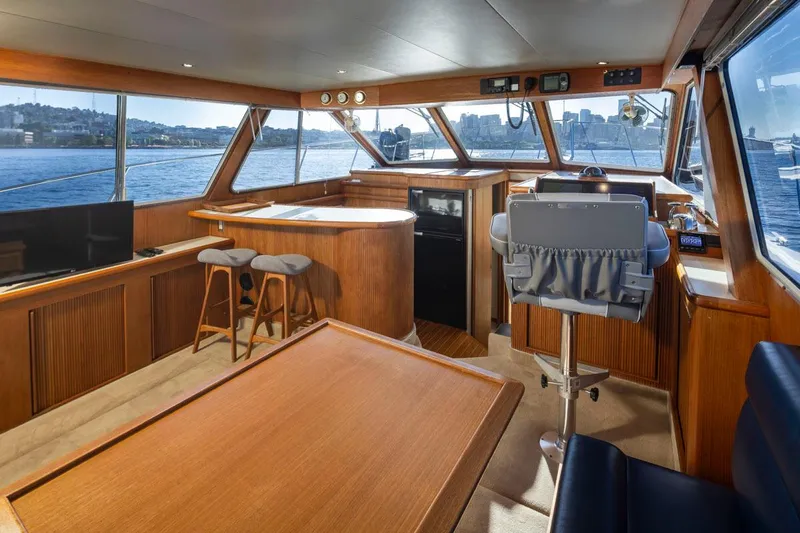 La Paz Yacht Photos Pics Interior of 1993 Tollycraft 40 Sport Sedan yacht with panoramic windows and elegant wood finish.