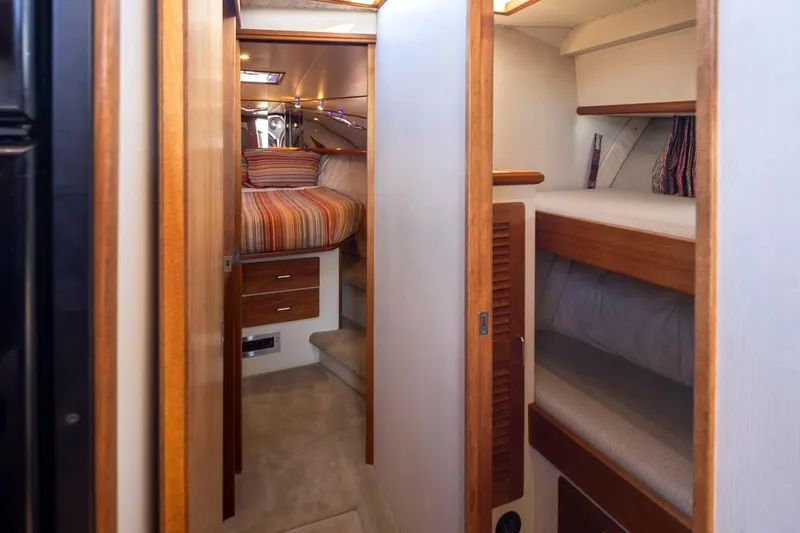 La Paz Yacht Photos Pics Interior of 1993 Tollycraft 40 Sport Sedan with cozy cabin and wooden accents.