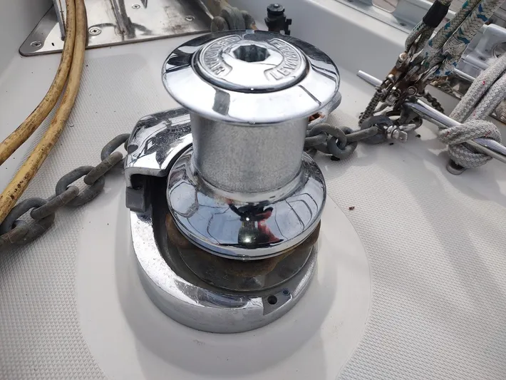 Seeker Yacht Photos Pics Chrome winch on a 2005 Stevens Custom 53/56 sailboat deck with ropes and chains.