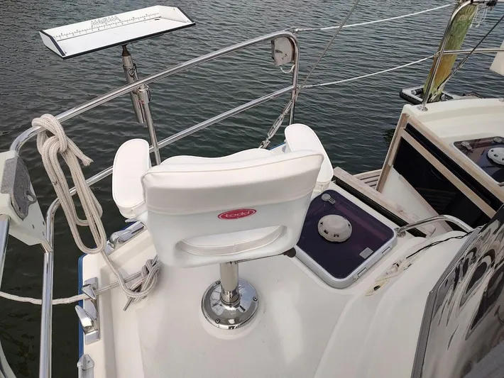 Seeker Yacht Photos Pics Stevens Custom 53/56 yacht deck with white chair and railing, 2005 model.