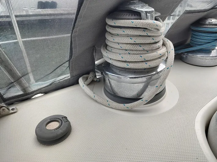 Seeker Yacht Photos Pics Close-up of a winch with coiled rope on a 2005 Stevens Custom 53/56 sailboat.