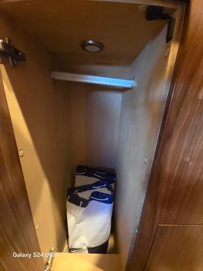 Ocean Driver Yacht Photos Pics Wooden storage compartment inside 2022 Riviera 54 Enclosed Flybridge yacht.