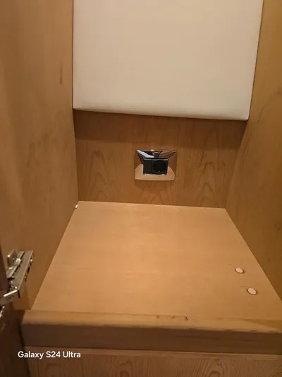 Ocean Driver Yacht Photos Pics Wooden cabinet interior on a 2022 Riviera 54 Enclosed Flybridge yacht.