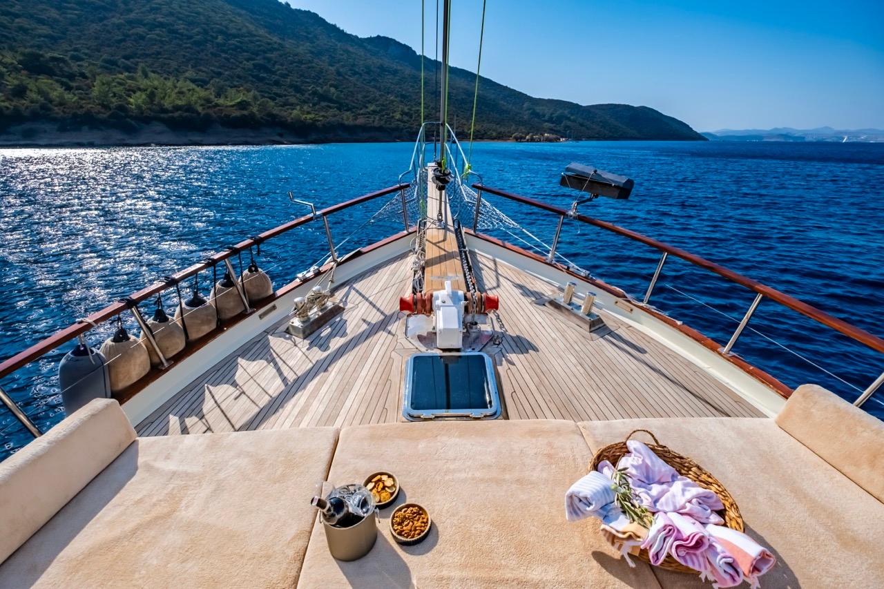 Luxurious yacht deck with snacks, towels, and stunning ocean view, Custom model, 1990.
