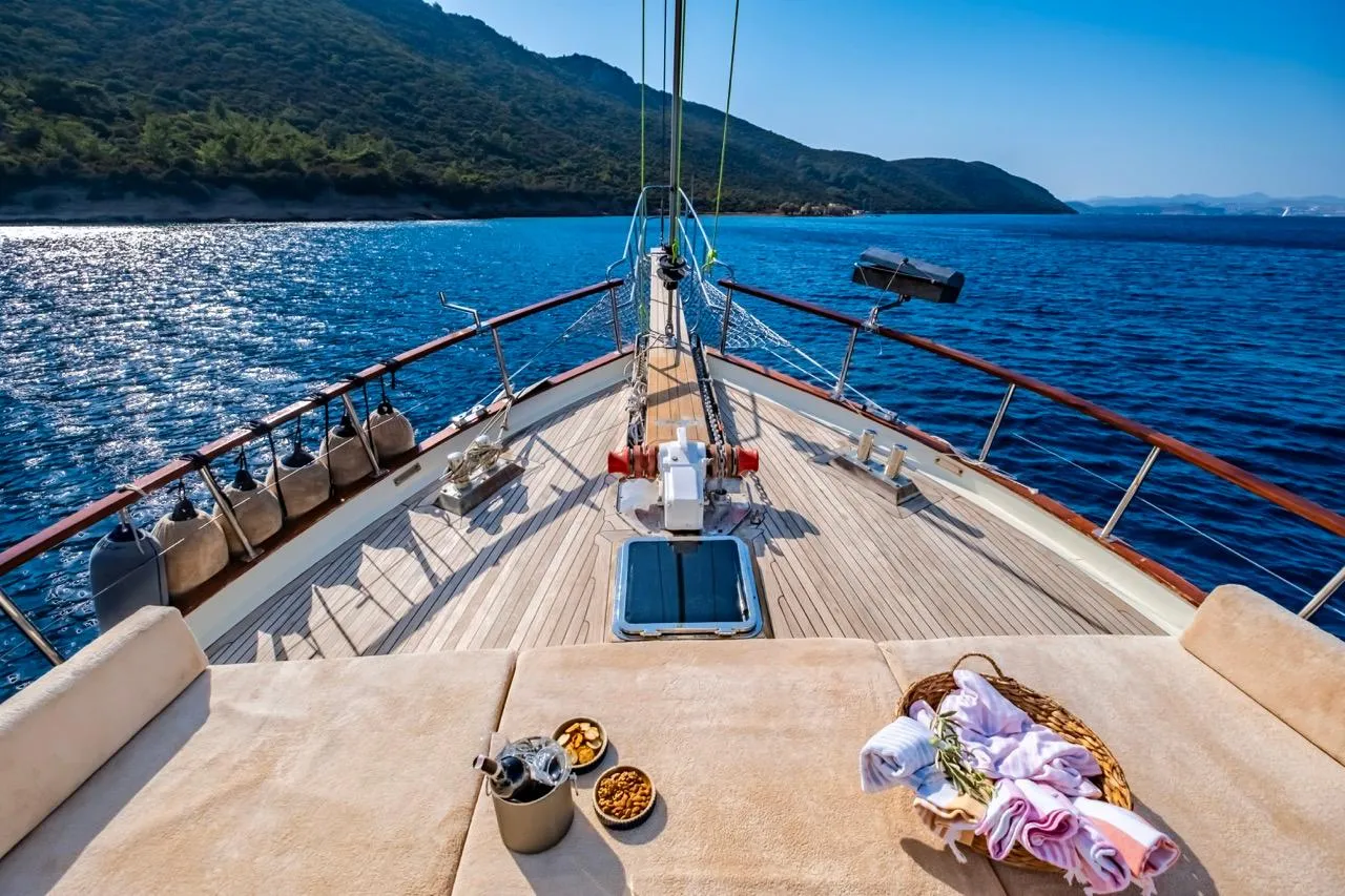 Luxurious yacht deck with snacks, towels, and stunning ocean view, Custom model, 1990.
