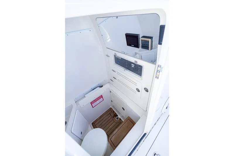 Bandit Yacht Photos Pics 2018 Jupiter 38 FS boat interior with control panel and wooden flooring.