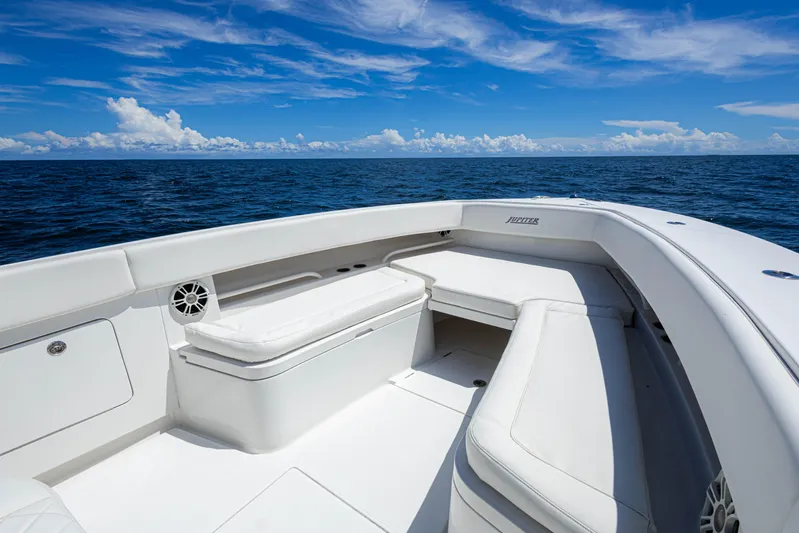 Bandit Yacht Photos Pics 2018 Jupiter 38 FS boat interior with white seating, ocean view, and blue sky.