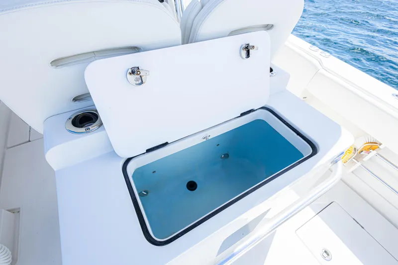 Bandit Yacht Photos Pics Open storage compartment on 2018 Jupiter 38 FS boat, with ocean in background.