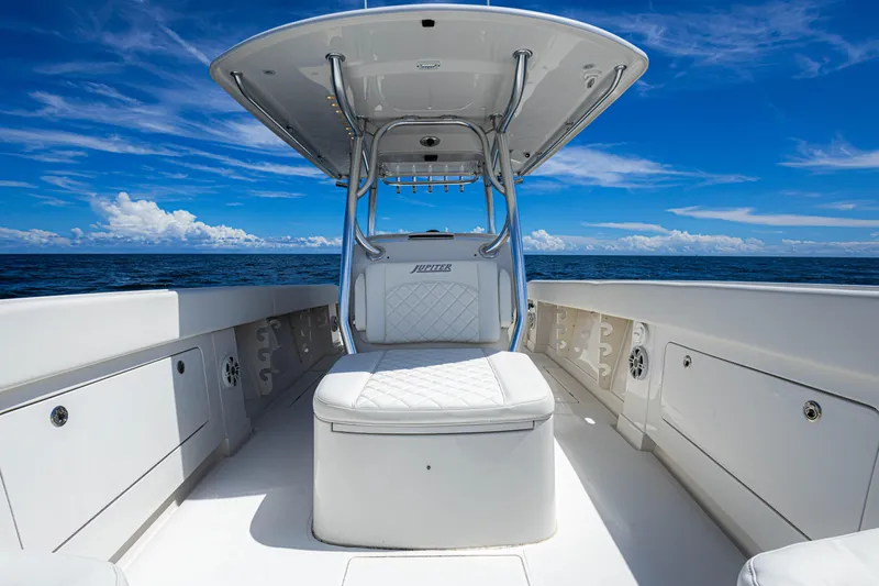 Bandit Yacht Photos Pics 2018 Jupiter 38 FS boat interior with white seating, under a clear blue sky.