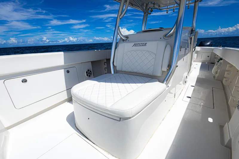 Bandit Yacht Photos Pics 2018 Jupiter 38 FS boat interior with white seating, ocean view, and clear blue sky.