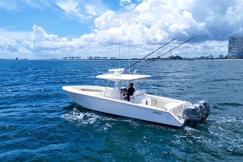 Bandit Yacht Photos Pics 2018 Jupiter 38 FS boat cruising on open ocean under a partly cloudy sky.