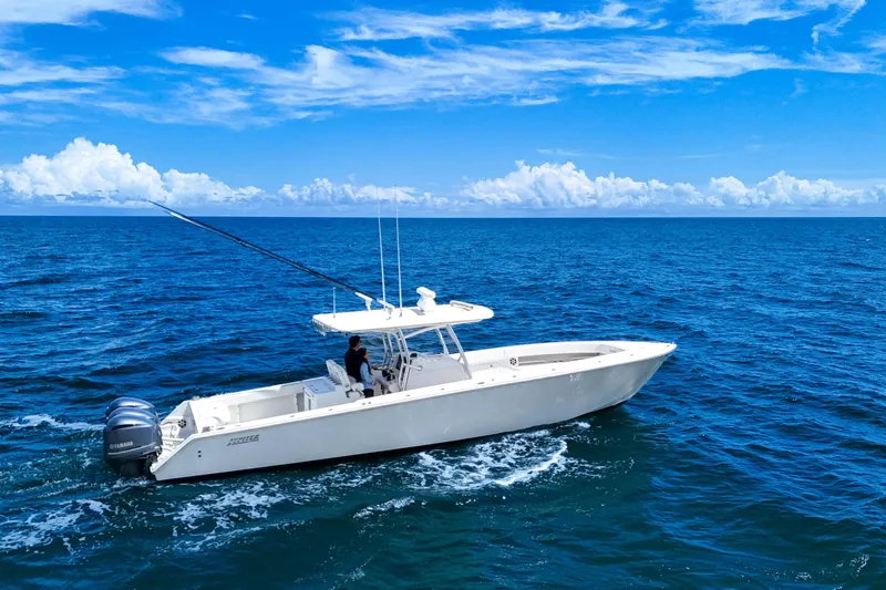 Bandit Yacht Photos Pics 2018 Jupiter 38 FS boat cruising on open ocean under clear blue sky.