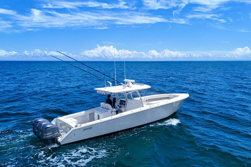 Bandit Yacht Photos Pics 2018 Jupiter 38 FS boat cruising on open ocean under clear blue sky.