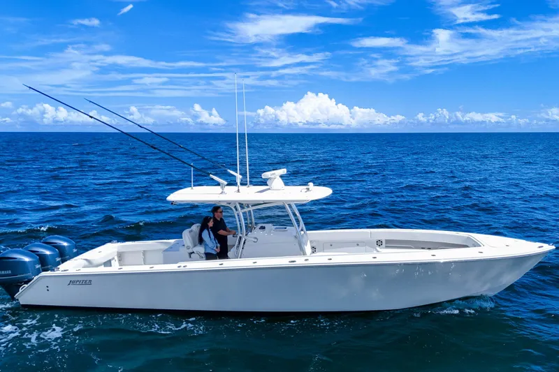 Bandit Yacht Photos Pics 2018 Jupiter 38 FS boat cruising on open ocean under clear blue sky.