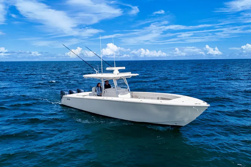 Bandit Yacht Photos Pics 2018 Jupiter 38 FS boat cruising on open ocean under clear blue sky.