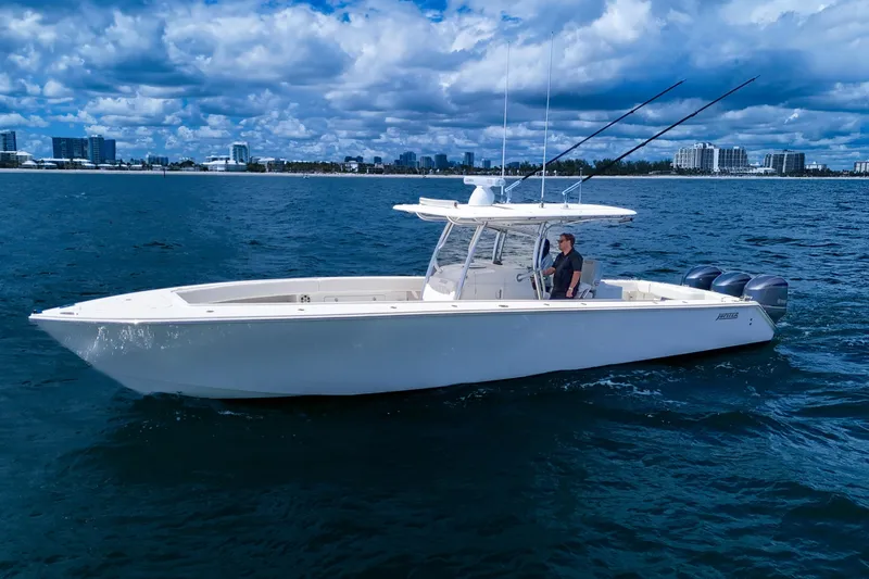 Bandit Yacht Photos Pics 2018 Jupiter 38 FS boat cruising on open water under a cloudy sky.