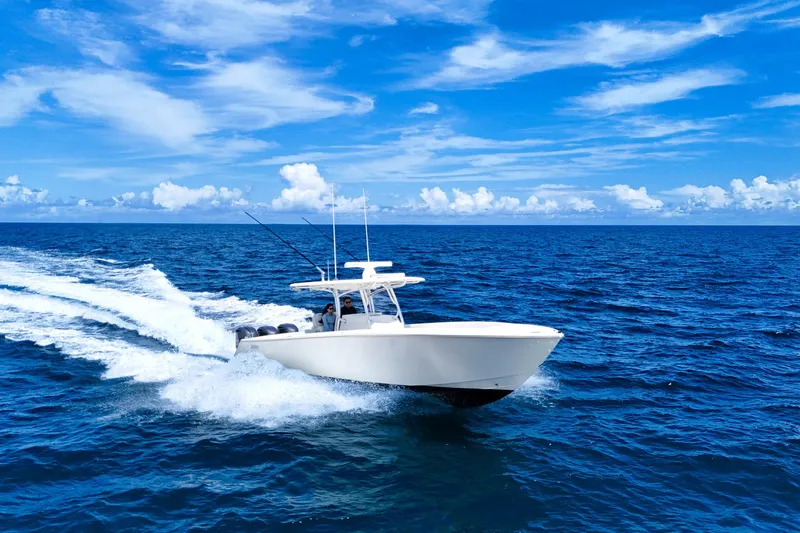 Bandit Yacht Photos Pics 2018 Jupiter 38 FS boat cruising on open ocean under clear blue sky.