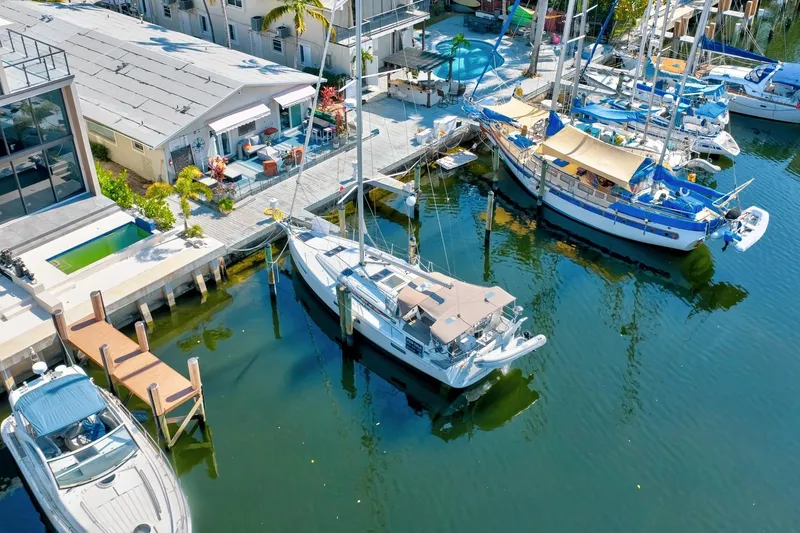 Dantari Yacht Photos Pics Aerial view of Jeanneau Sun Odyssey 440 docked at marina, 2021 model.