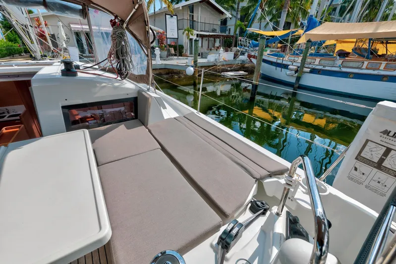 Dantari Yacht Photos Pics Jeanneau Sun Odyssey 440, 2021 model, docked with comfortable seating and marina view.