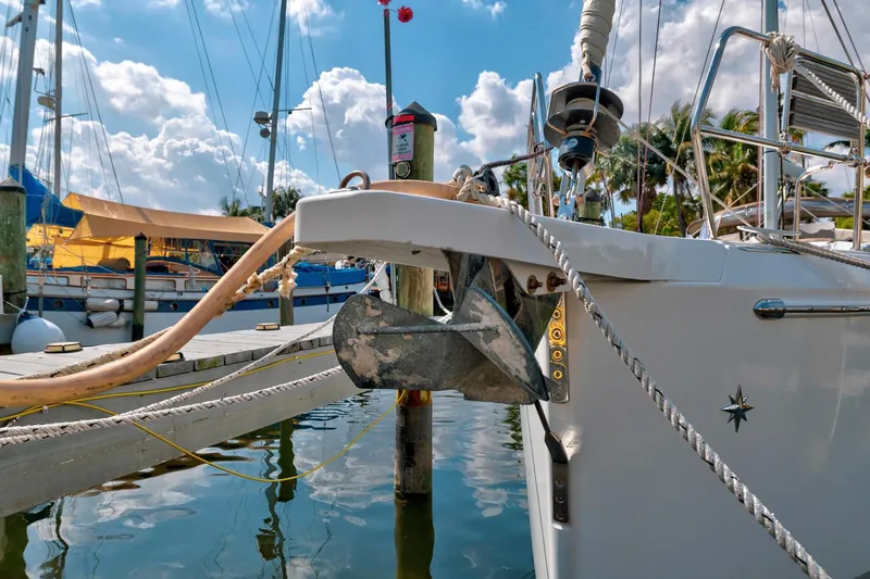 Dantari Yacht Photos Pics Jeanneau Sun Odyssey 440 sailboat docked, showcasing anchor and marina setting, 2021 model.