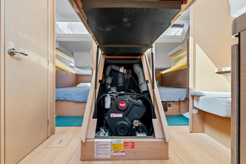 Dantari Yacht Photos Pics Engine compartment of 2021 Jeanneau Sun Odyssey 440 sailboat, showcasing interior layout.