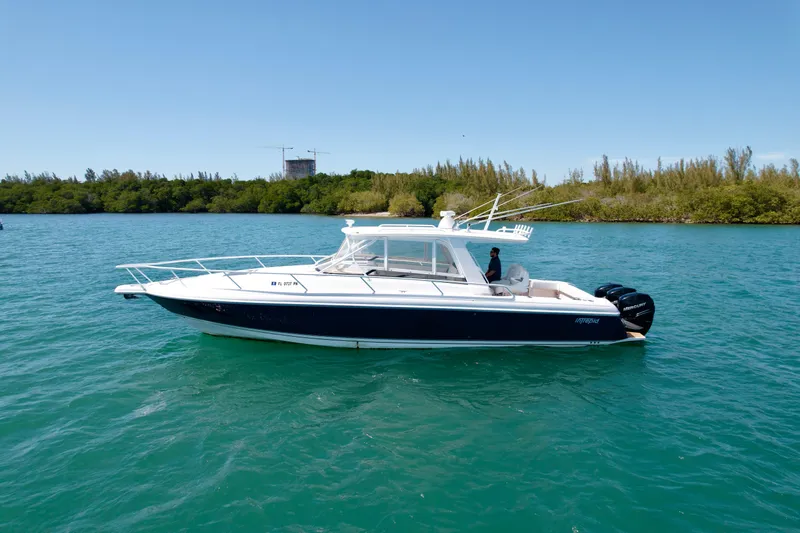  Yacht Photos Pics 2013 Intrepid 390 Sport Yacht on calm water, side view.
