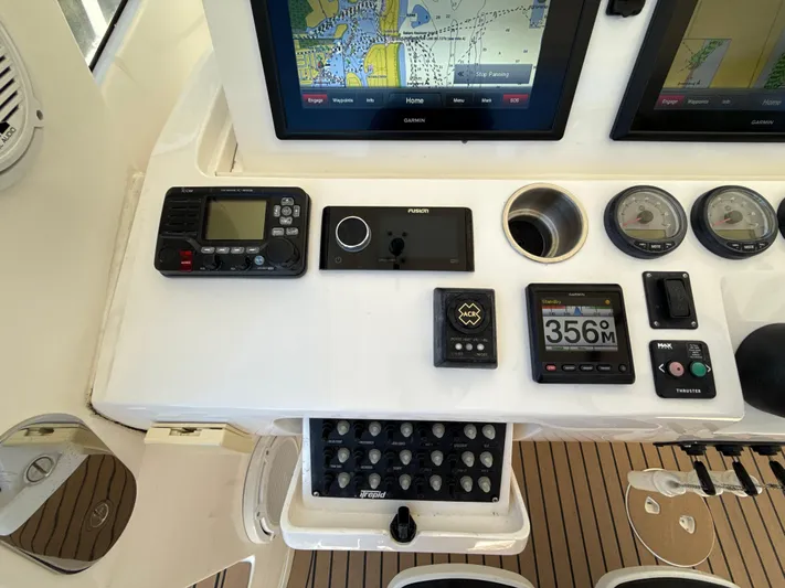 Yacht Photos Pics Control panel of a 2013 Intrepid 390 Sport Yacht with navigation and communication equipment.