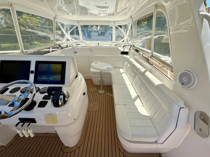  Yacht Photos Pics 2013 Intrepid 390 Sport Yacht interior with helm, seating, and navigation screens.