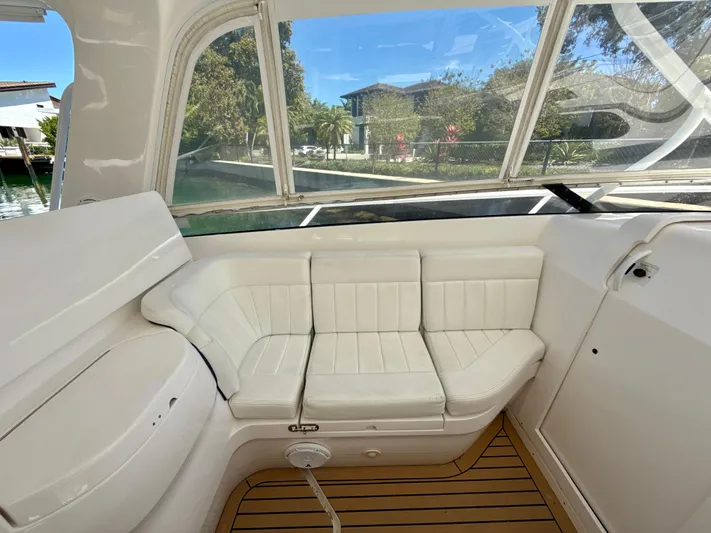  Yacht Photos Pics 2013 Intrepid 390 Sport Yacht interior with white seating and teak flooring.